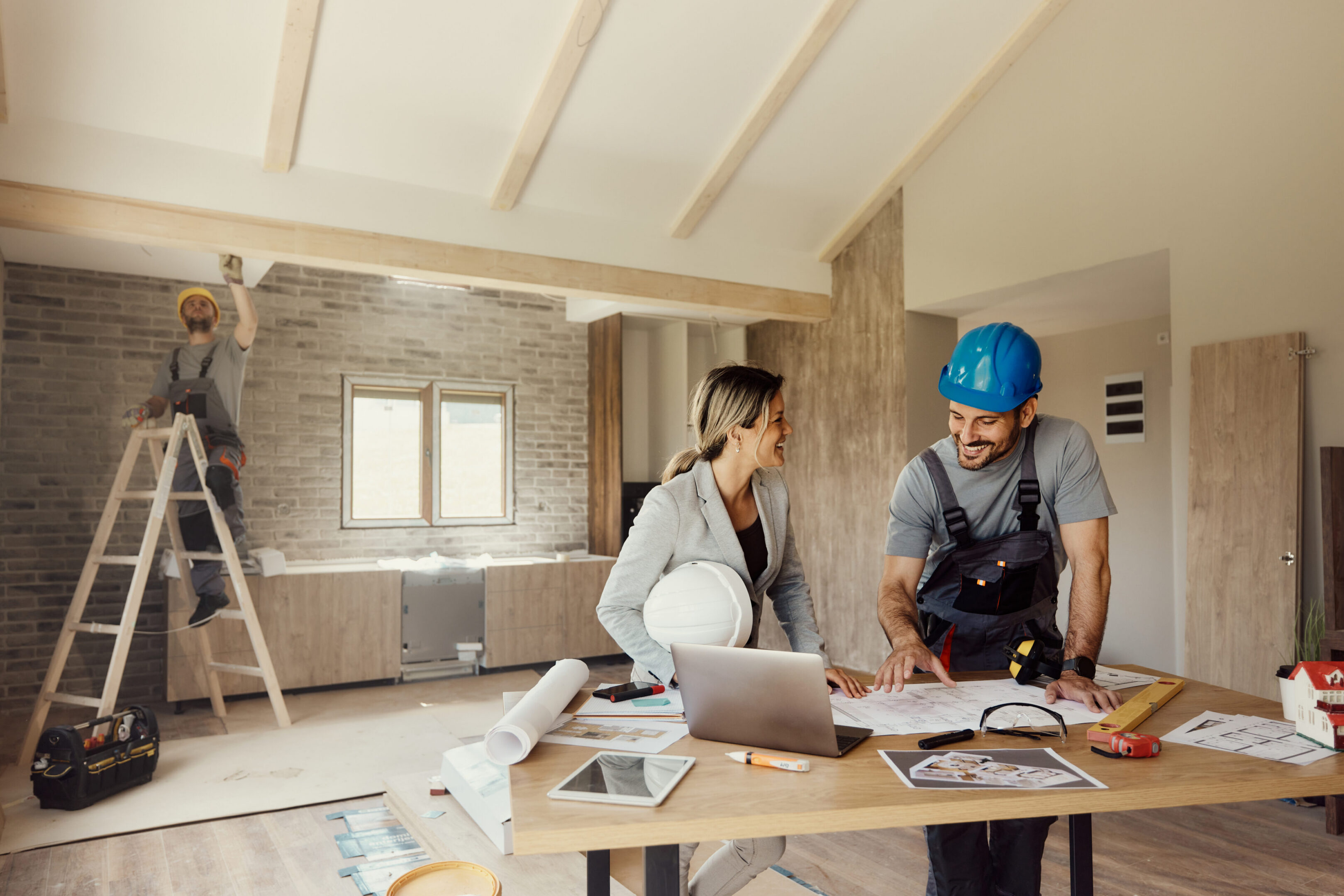 Construction team reviewing blueprints
